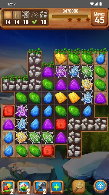 A gem board part-covered by cobwebs and stone tiles, forty-five moves remaining